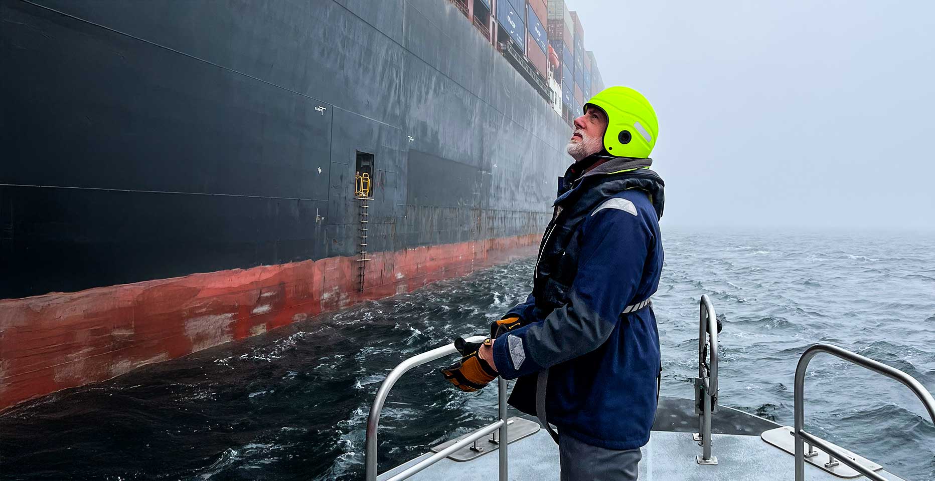 Puget Sound Pilots Who We Are - Pilot prepares to board a ship in rough seas